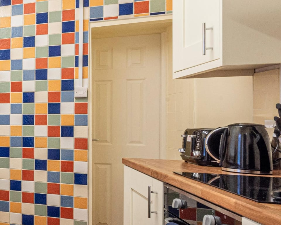 Kitchen or kitchenette, stove, toaster