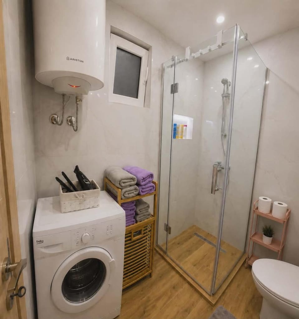 Shower, Toilet, Bathroom, towels, washing machine, dryer
