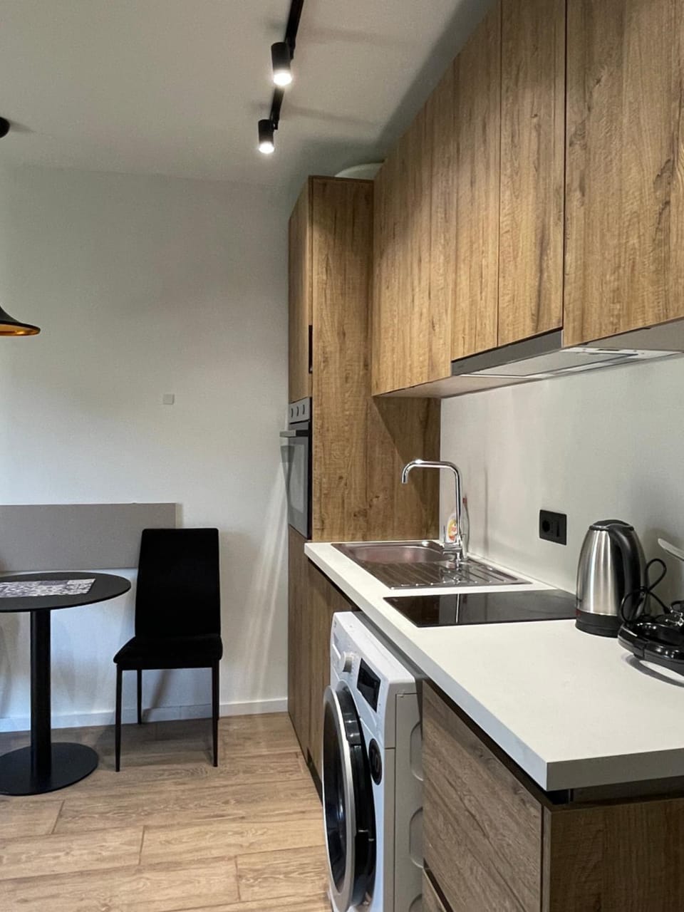 Kitchen or kitchenette, oven, stove, toaster, washing machine, dryer