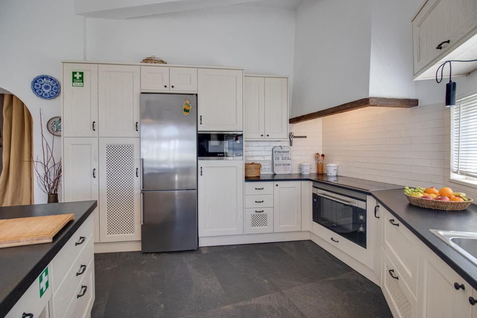 Kitchen or kitchenette, dishwasher, oven, stove