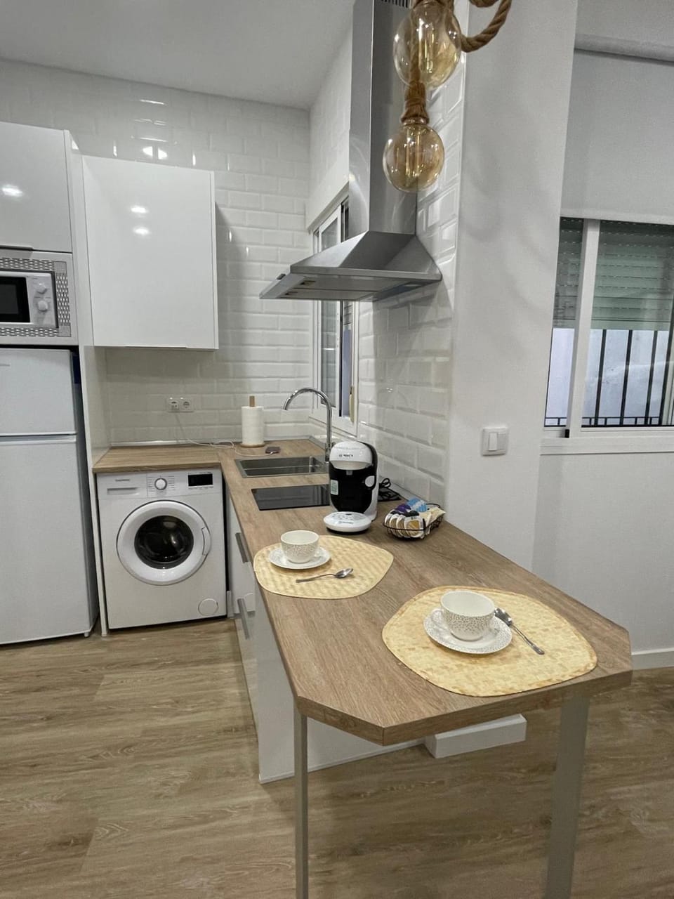 Kitchen or kitchenette, stove, washing machine