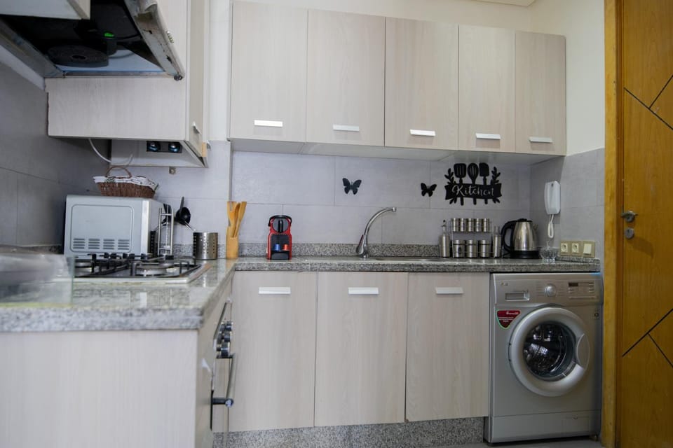 Kitchen or kitchenette, dishwasher, oven, stove, washing machine