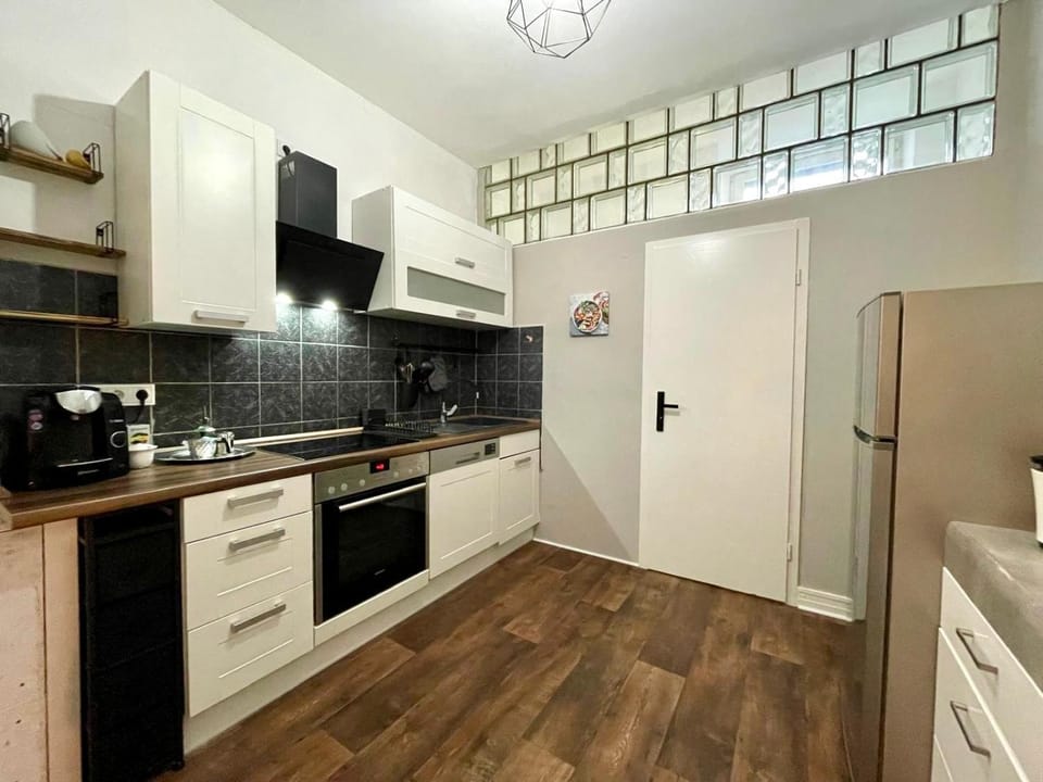Kitchen or kitchenette, dishwasher, oven, stove, toaster