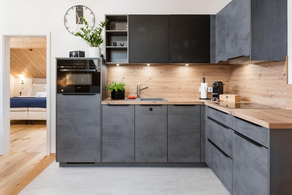 Kitchen or kitchenette, dishwasher, microwave, oven, stove