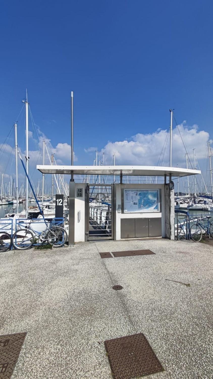 Sailboat land and sea, vegetated Docked boat in La Rochelle