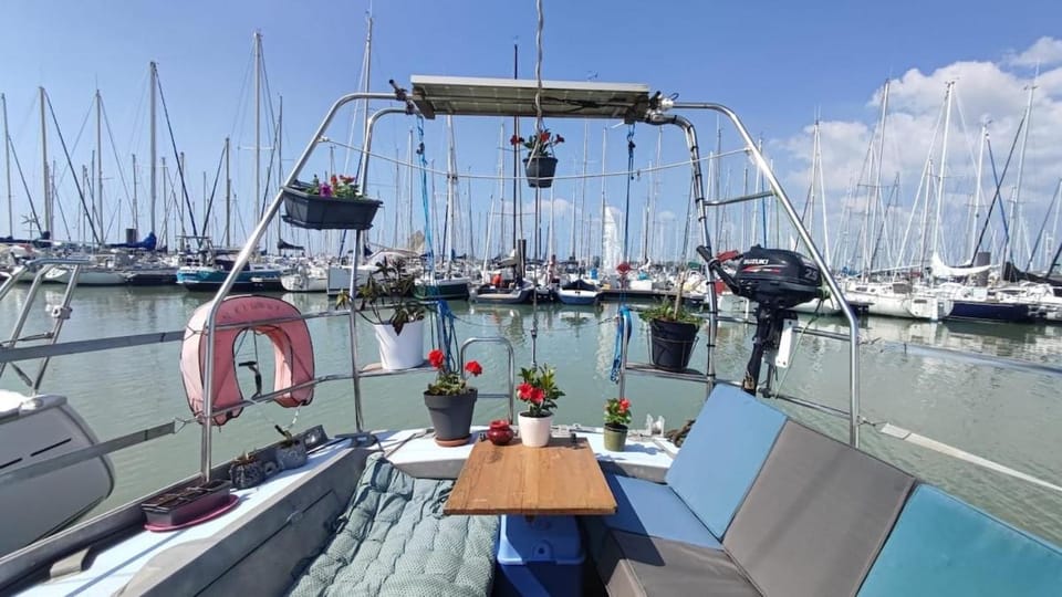 Sailboat land and sea, vegetated Docked boat in La Rochelle