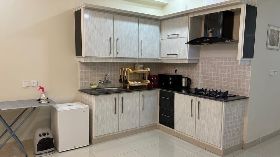 Kitchen or kitchenette, flat iron, oven, stove