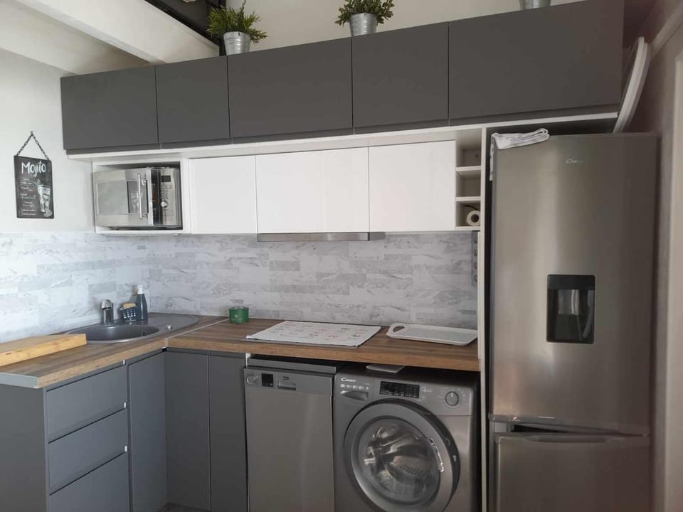 Kitchen or kitchenette, dishwasher, stove, washing machine, dryer