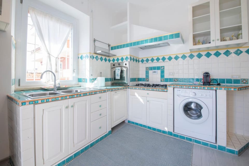 Kitchen or kitchenette, dishwasher, oven, stove, washing machine