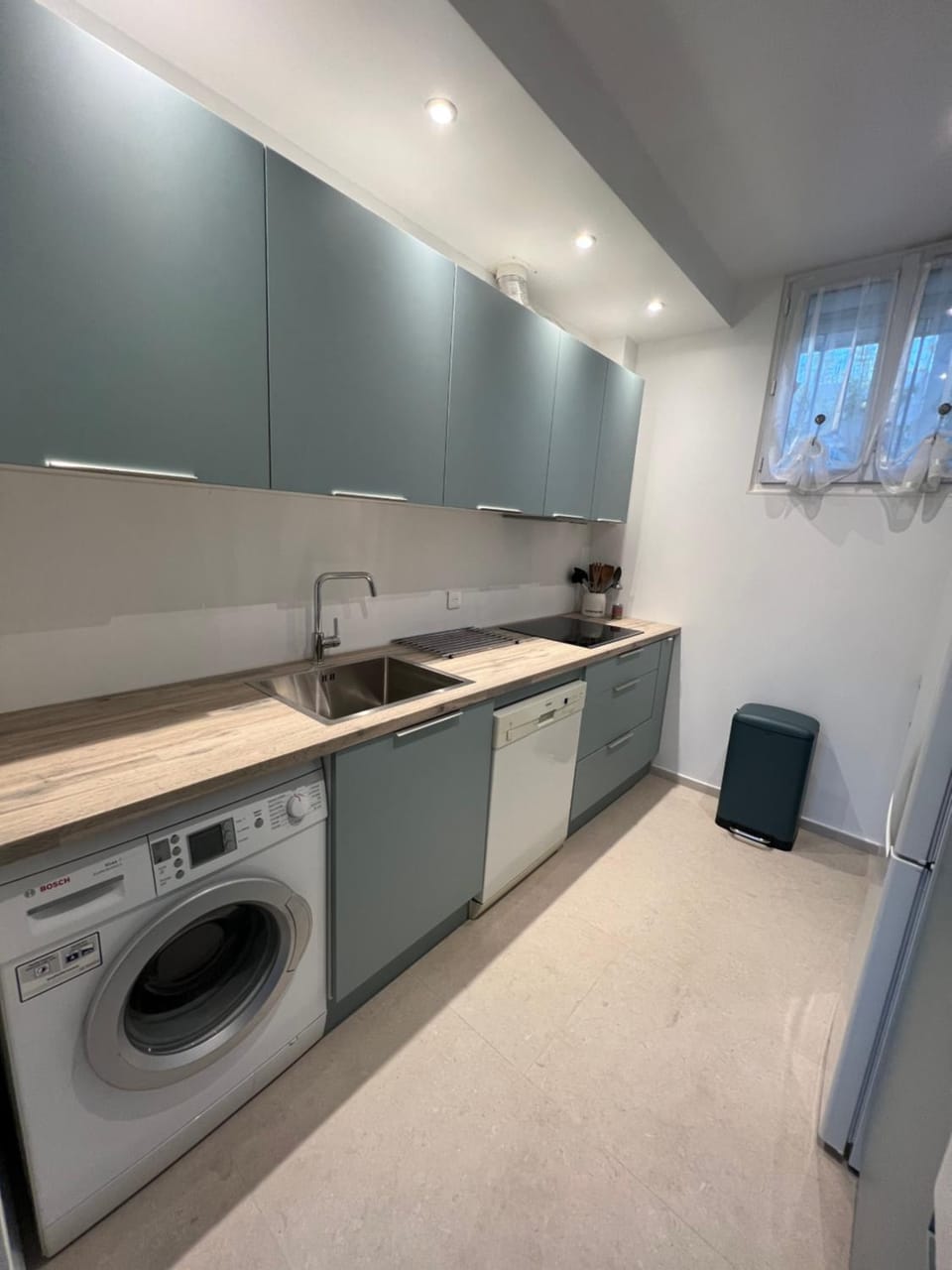 Kitchen or kitchenette, dishwasher, stove, washing machine