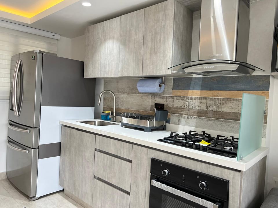 Kitchen or kitchenette, dishwasher, oven, stove