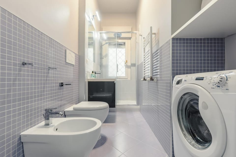 Shower, Toilet, Bathroom, towels, washing machine, dryer