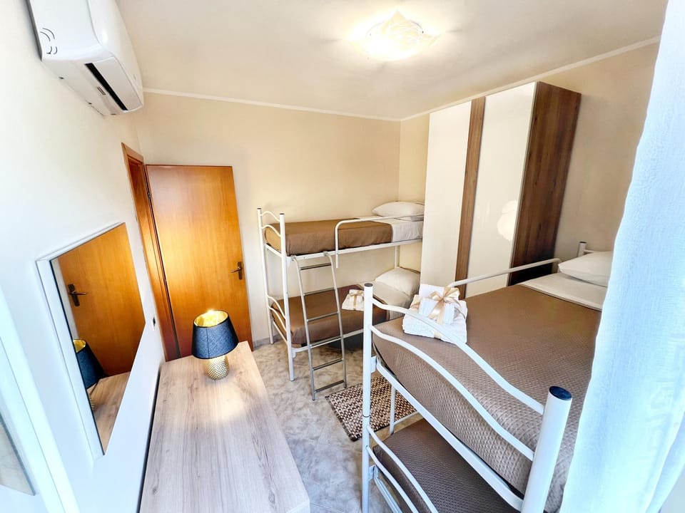 Bed, Photo of the whole room, Bedroom, bunk bed, towels, wardrobe, air conditioner