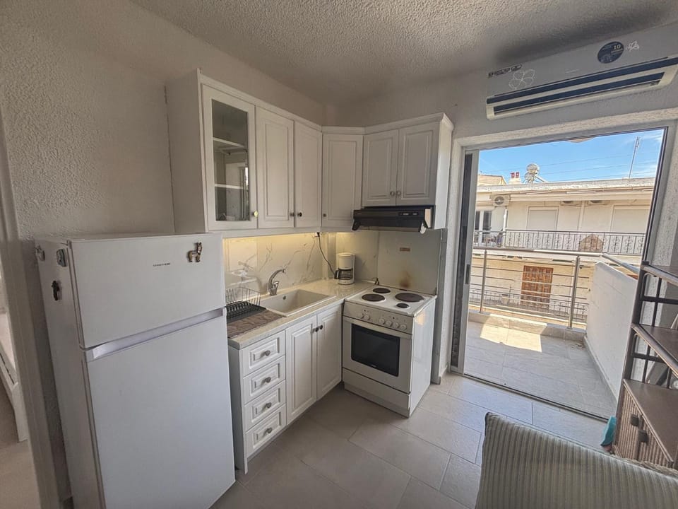 Kitchen or kitchenette, oven, stove, air conditioner