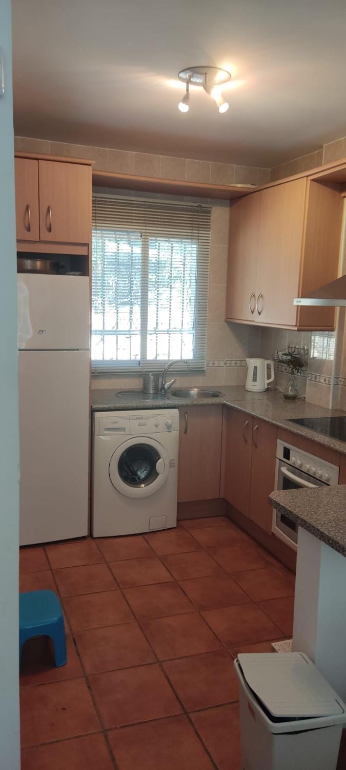 Kitchen or kitchenette, oven, stove, washing machine