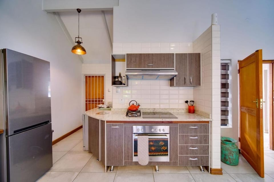 Kitchen or kitchenette, dishwasher, oven, stove