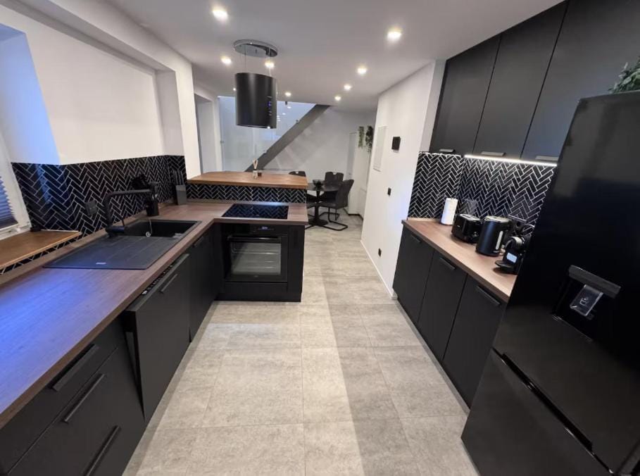 Kitchen or kitchenette, dishwasher, oven, stove