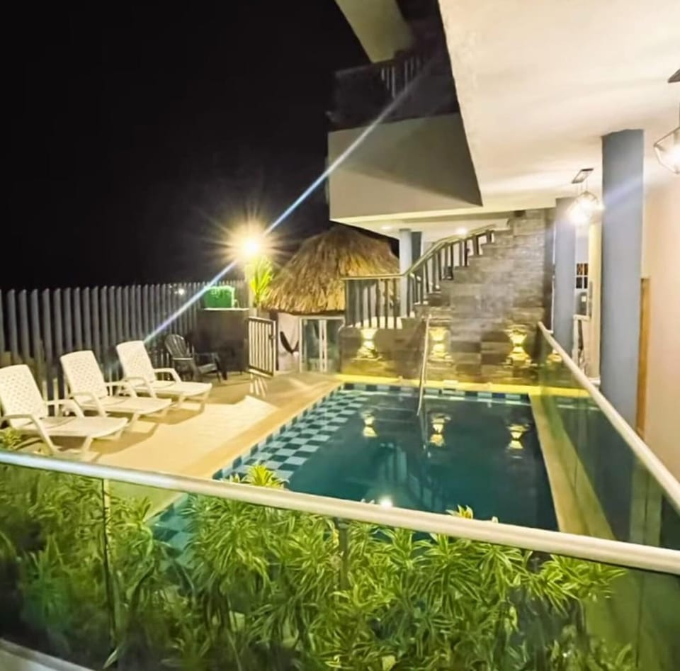 Patio, Night, Pool view, Swimming pool, sunbed