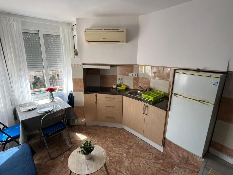 Kitchen or kitchenette, stove, air conditioner