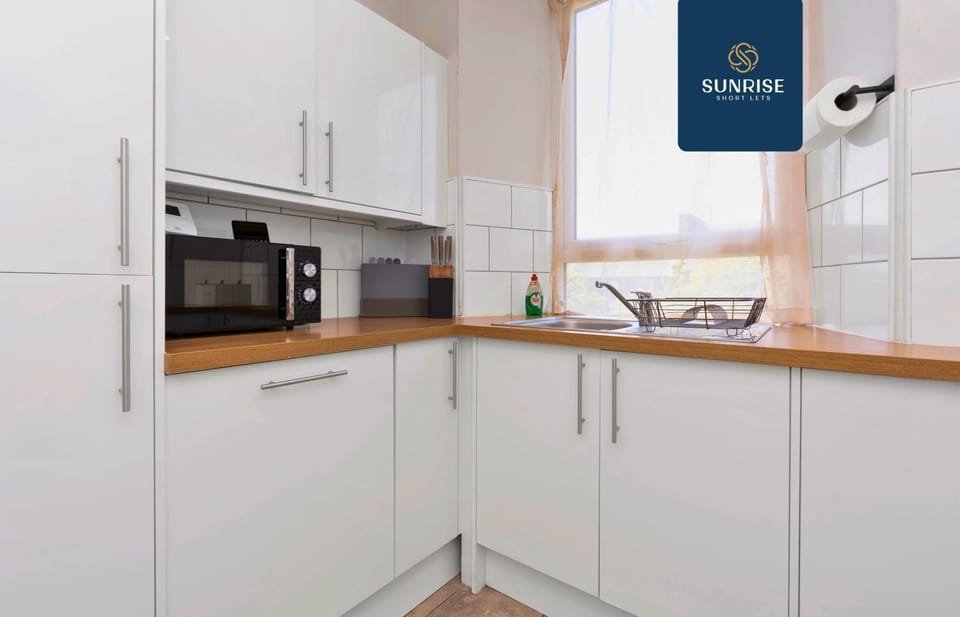 Kitchen or kitchenette, dishwasher, microwave, stove