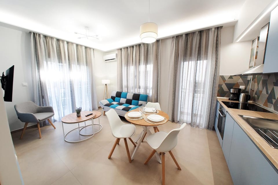 TV and multimedia, Kitchen or kitchenette, Living room, Seating area, Dining area, oven, stove, air conditioner