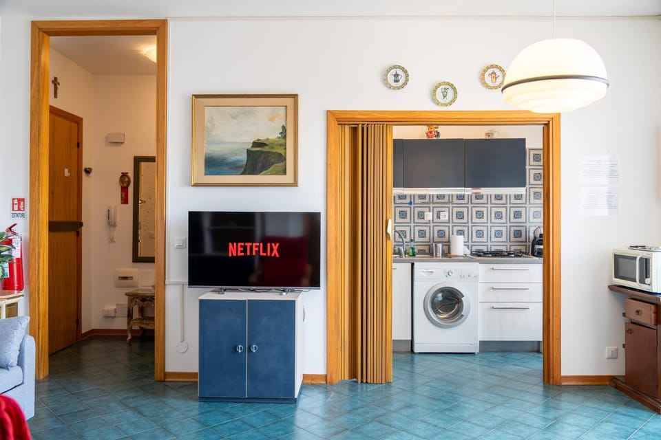 Kitchen or kitchenette, oven, stove, washing machine, dryer