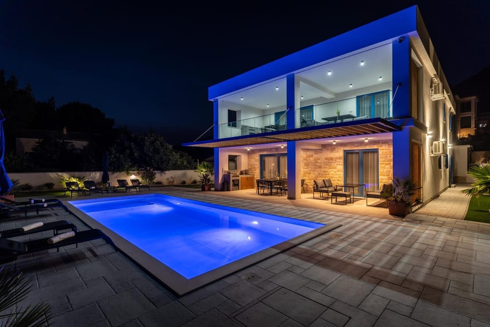 Property building, Patio, Night, Pool view, Swimming pool