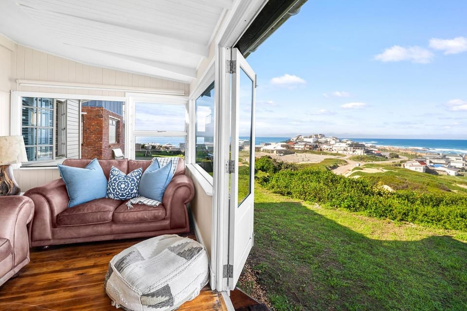 Natural landscape, View (from property/room), Living room, Seating area, Sea view
