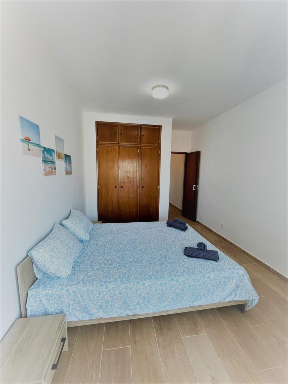 Bed, towels, wardrobe
