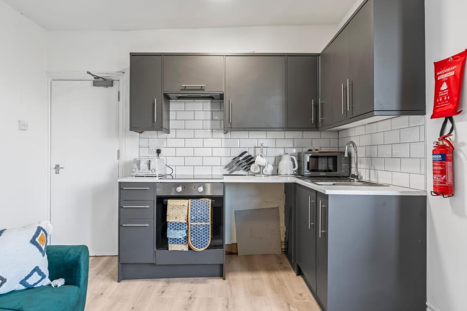 Kitchen or kitchenette, oven, stove, toaster