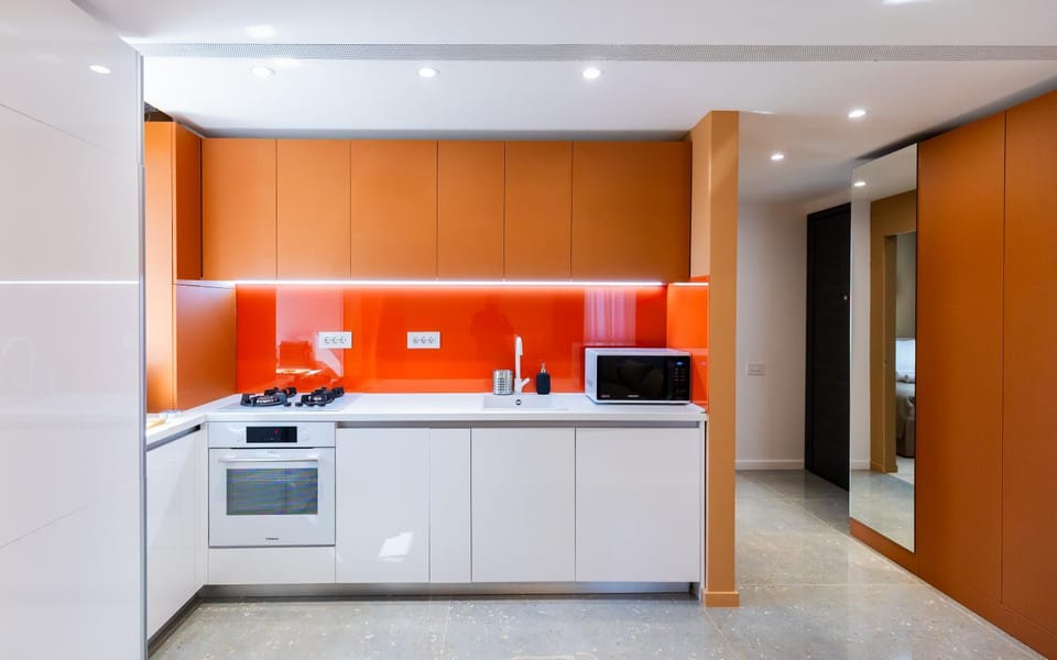 Kitchen or kitchenette, dishwasher, oven, stove