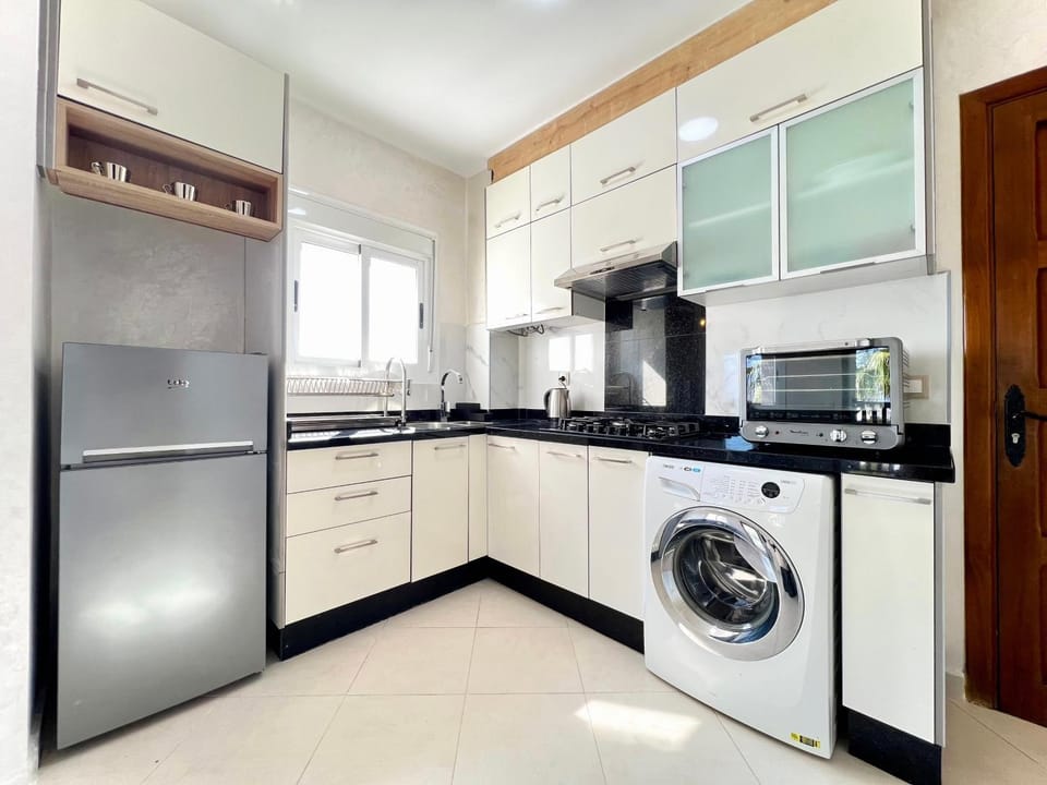 Kitchen or kitchenette, oven, stove, washing machine