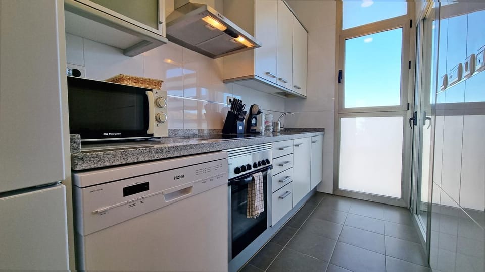 Kitchen or kitchenette, dishwasher, oven, stove, toaster