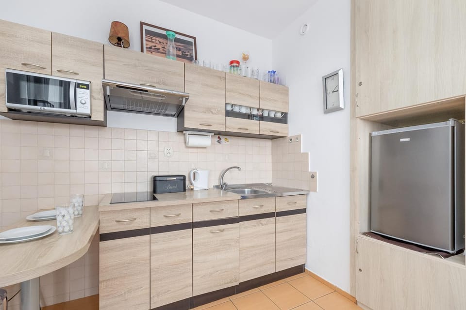 Kitchen or kitchenette, stove, toaster