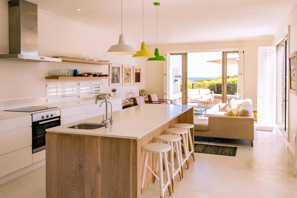 Kitchen or kitchenette, Living room, Seating area, Pool view, dishwasher, stove
