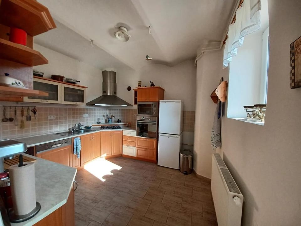 Kitchen or kitchenette, dishwasher, microwave, oven, stove