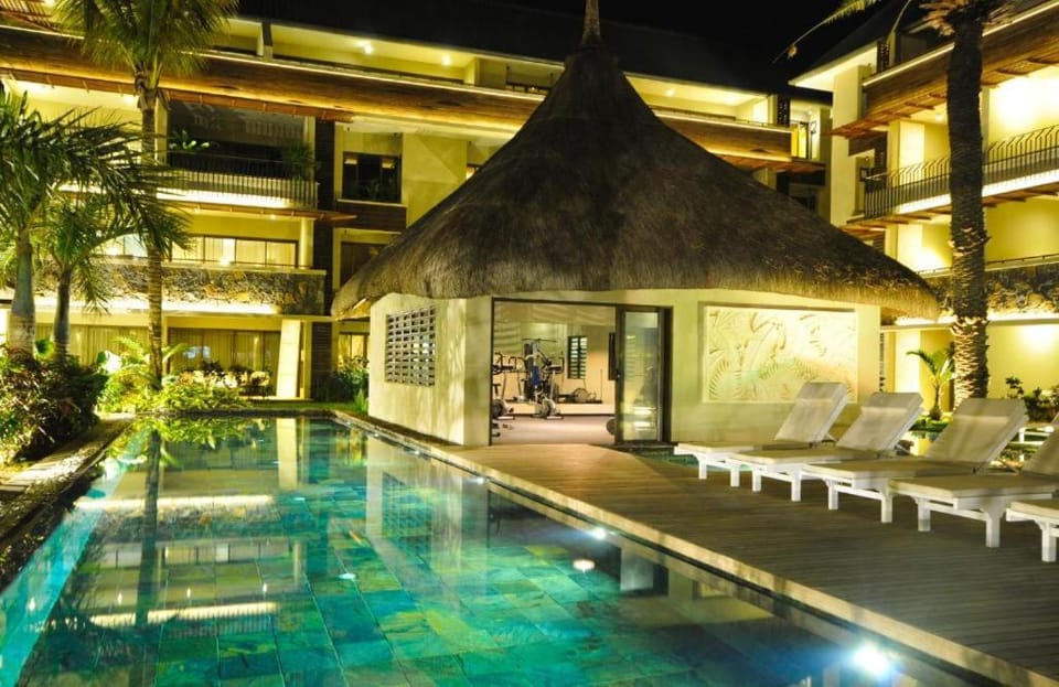 Property building, Patio, Night, Fitness centre/facilities, Pool view, Swimming pool, sunbed