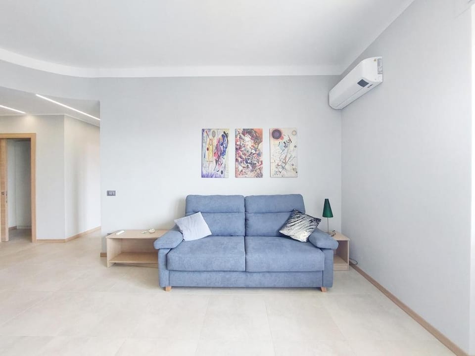 Bed, TV and multimedia, Living room, Seating area, air conditioner