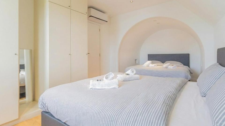Bed, Photo of the whole room, Decorative detail, Bedroom, towels, wardrobe, air conditioner