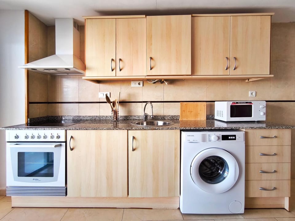Kitchen or kitchenette, washing machine
