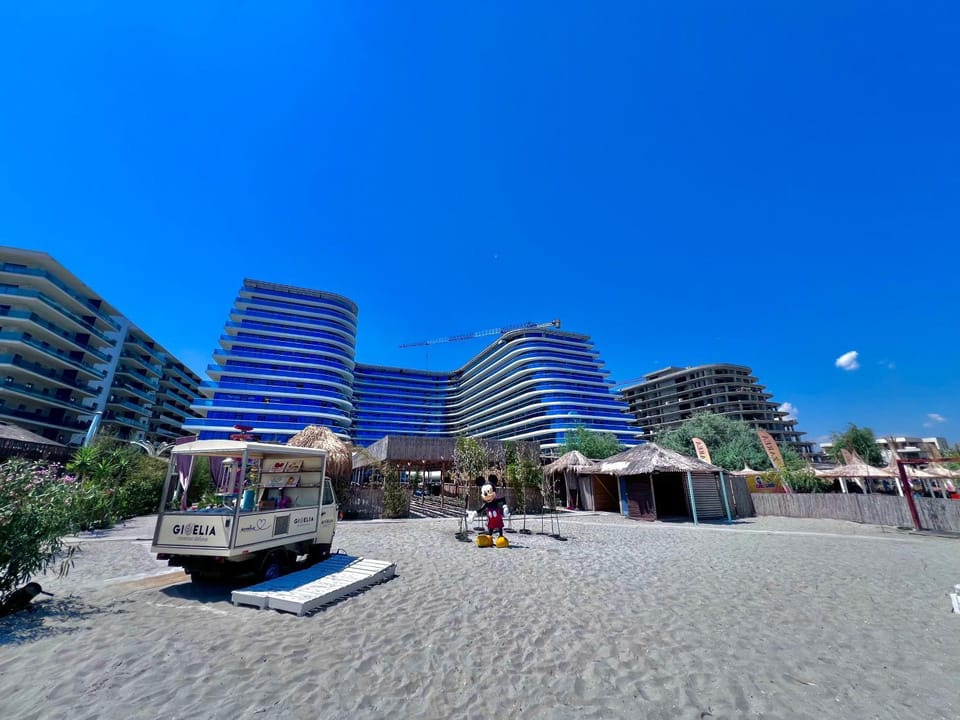 Property building, Nearby landmark, Natural landscape, Beach, Sea view, sunbed