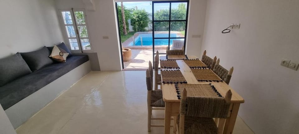Living room, Seating area, Dining area, Pool view