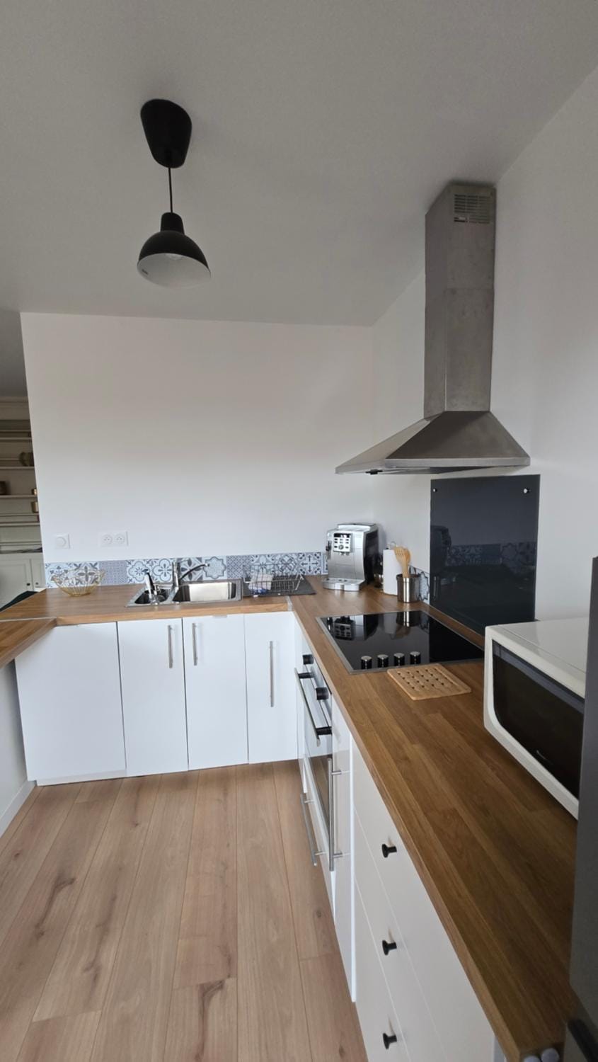 Kitchen or kitchenette, dishwasher, microwave, oven, stove