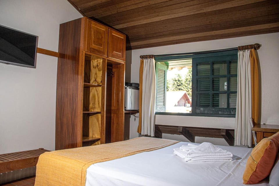 Bed, towels, wardrobe