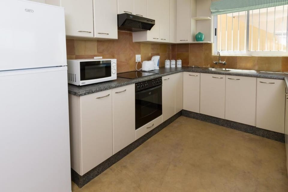 Kitchen or kitchenette, oven, stove, toaster