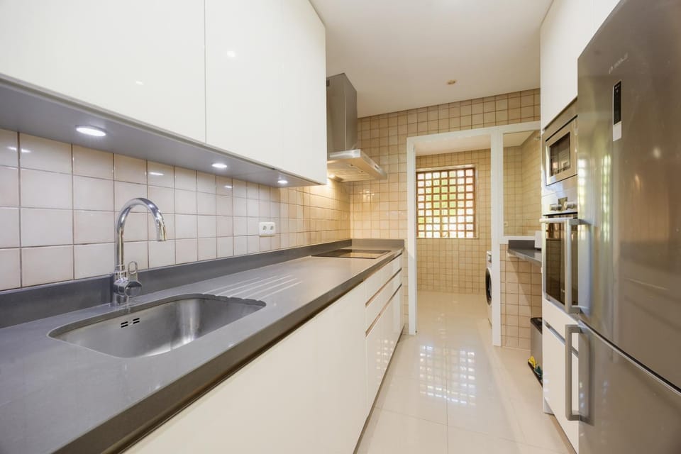 Kitchen or kitchenette, dishwasher, oven, stove