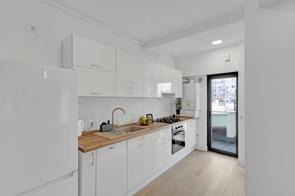 Kitchen or kitchenette, dishwasher, oven, stove