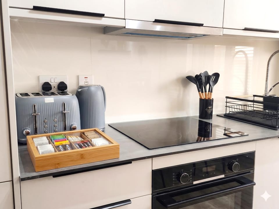 Kitchen or kitchenette, dishwasher, stove, toaster