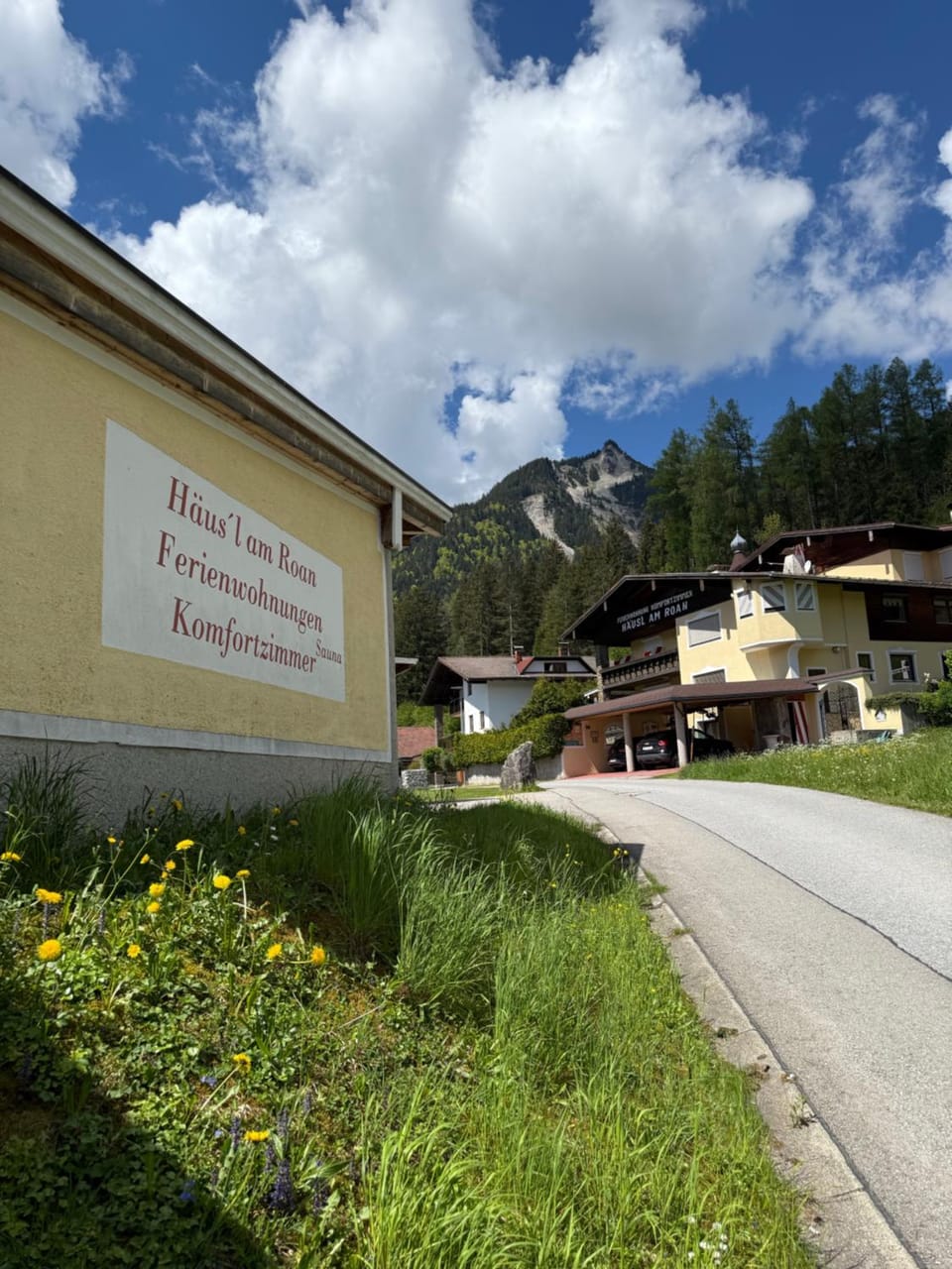 Property building, Spring, Day, Property logo or sign, Natural landscape, Logo/Certificate/Sign, Mountain view