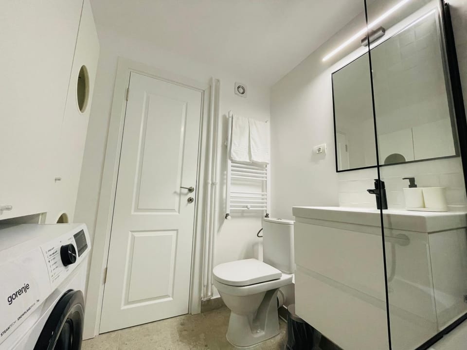 Shower, Toilet, Bathroom, towels, washing machine, dryer
